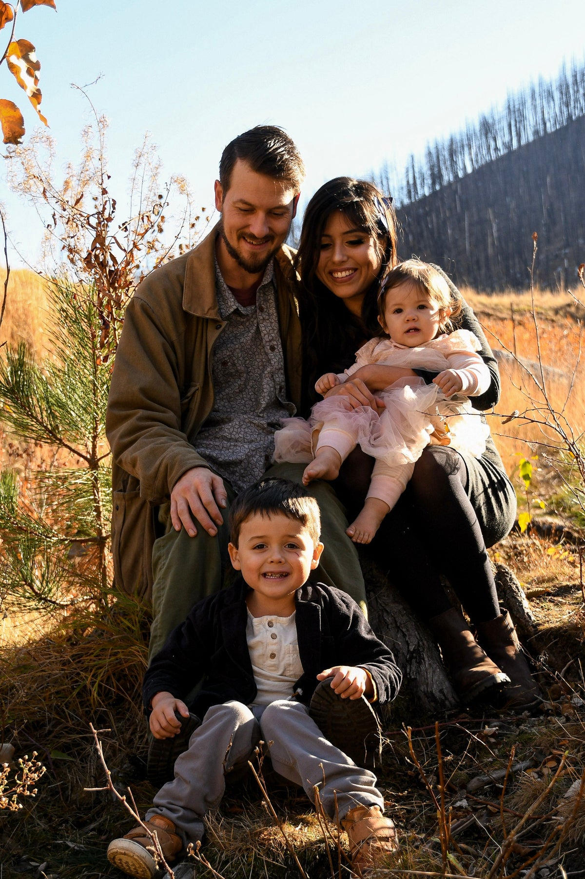 Eternal Bloom Montana Family sitting outdoors in the mountains thinking about foraging